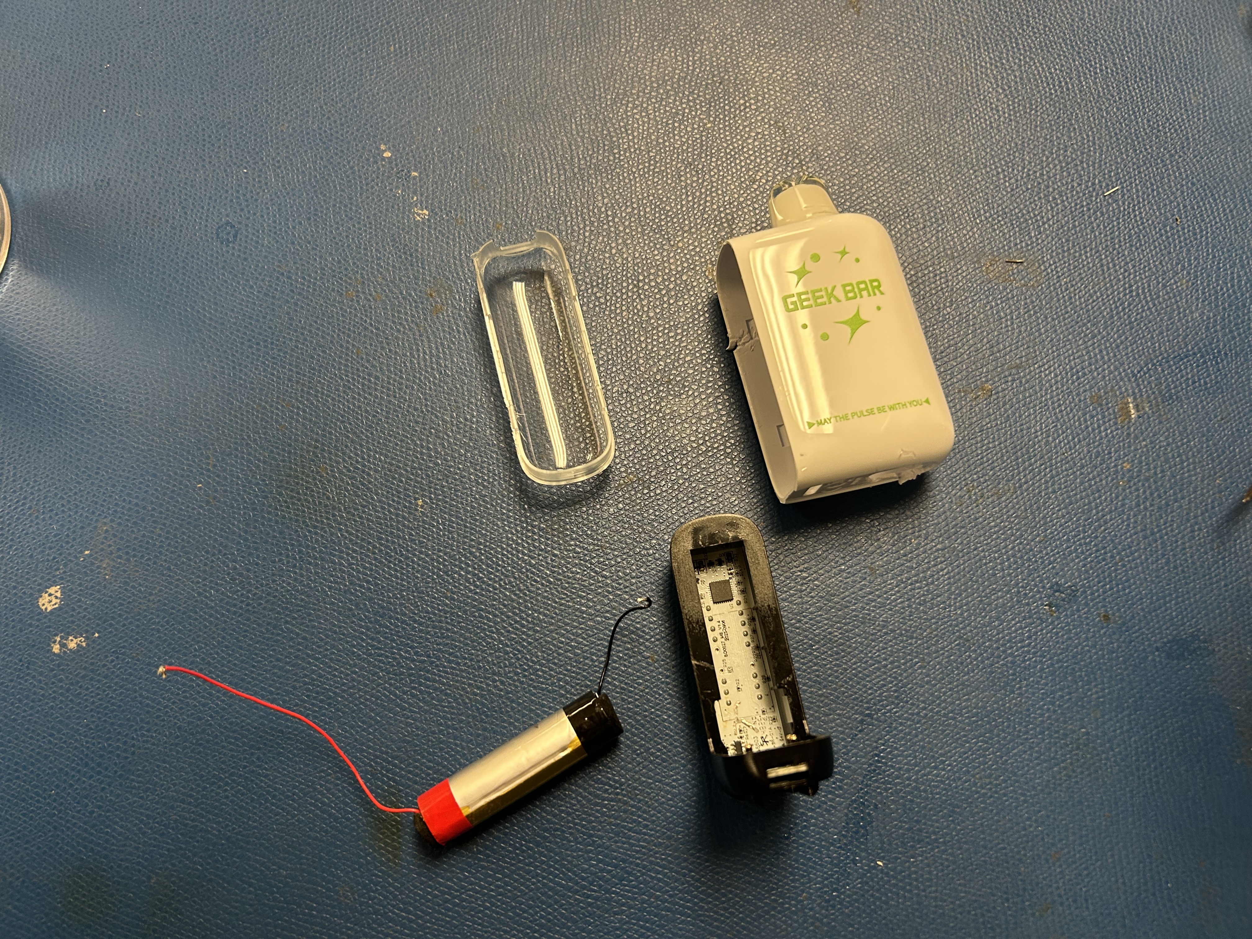 The PY32F030 board from a disposable vape, wired to a Raspberry Pi over SWD
